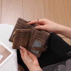 Deep brown RFID blocking tri-fold faux leather wallet with card slots and coin pocket
