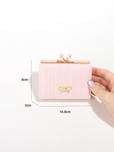 Pink croc-texture wallet size detail showing dimensions 10.8cm by 8cm with pearl clasp
