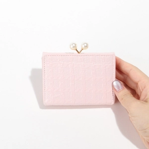 Pink faux crocodile leather short wallet for women featuring elegant pearl clasp closure