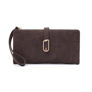Detail of dark brown long wallet with a golden leaf buckle and a matching wrist strap