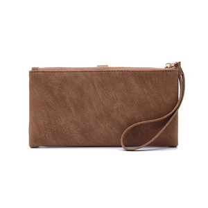 Close-up of brown textured PU leather wallet with zipper closure and a matching wristlet strap