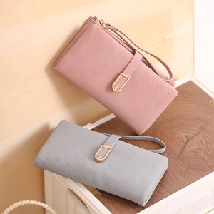 Detail of elegant PU leather long wallets with leaf metal buckle and wrist strap