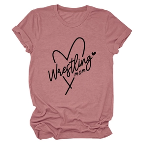 Detail of the Wrestling Mom heart logo on a dusty rose short sleeve crew neck T-shirt