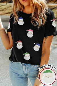 Détails de patchs Père Noël en sequins colorés sur un t-shirt noir en coton doux