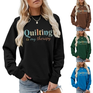 Detail view of colorful Quilting is my therapy slogan print on high-quality sweatshirts