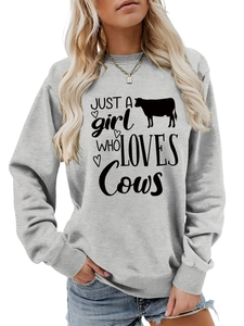Detail of grey sweatshirt showing cow silhouette and Just a girl who loves cows print