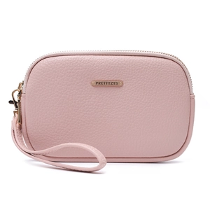Detail of lychee textured leather wristlet bag with gold zipper and metal logo