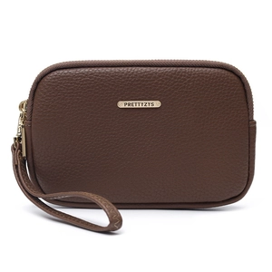 Detail of dark brown lychee leather clutch with gold zipper and wristlet strap