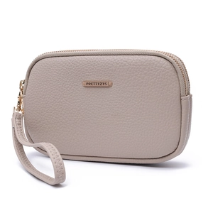 Detail of taupe pebbled leather clutch with dual zippers and brand metal logo plate