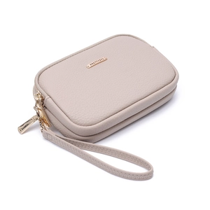 Detail view of the beige pebbled leather double-zipper wallet with gold-tone hardware