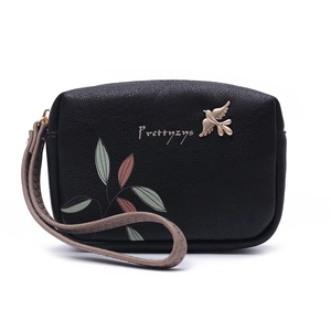 Detailed view of black PU leather wallet with colorful leaf print and golden bird charm