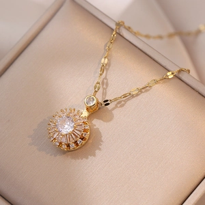 Elegant rotating zircon flower pendant necklace in gold finish on a velvet display