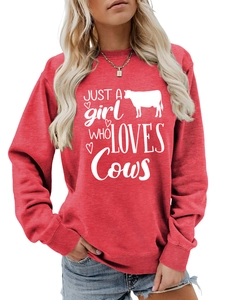 Detail of red crewneck sweatshirt featuring white Just a girl who loves Cows print design