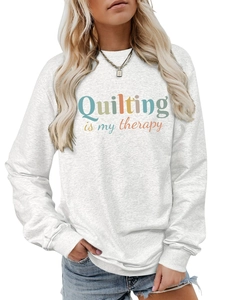 Detail of grey heather sweatshirt featuring 'Quilting is my therapy' colorful print design
