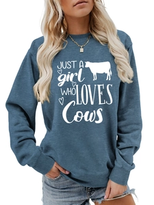 Detail of navy blue crewneck sweatshirt with 'Just a Girl Who Loves Cows' graphic