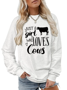 Detail of ribbed cuffs and Just A Girl Who Loves Cows print on white crewneck sweatshirt