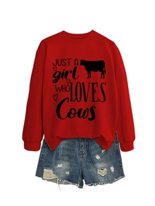 Flat lay set with red graphic sweatshirt and distressed light blue denim shorts