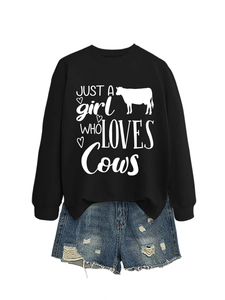 Detail of Just A Girl Who Loves Cows black sweatshirt with white cow graphic and heart