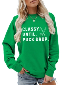 Detail of Classy Until Puck Drop hockey slogan print on green long sleeve sweatshirt