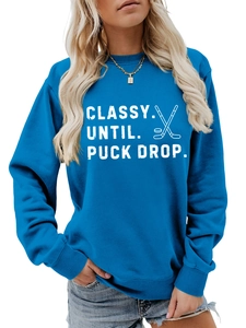 Detail of ribbed cuffs and Classy Until Puck Drop hockey print on blue sweatshirt