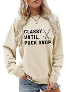 Detail of Classy Until Puck Drop hockey slogan print on cream long sleeve sweatshirt