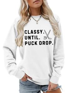 Close-up of white crew neck sweatshirt with CLASSY UNTIL PUCK DROP hockey print