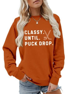 Detail of Classy Until Puck Drop orange sweatshirt with high-quality screen printing