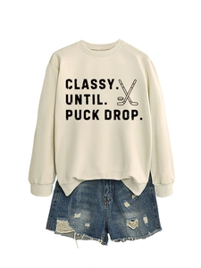Flat lay of off-white Classy Until Puck Drop sweatshirt with distressed denim shorts