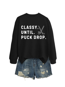 Close-up of Classy Until Puck Drop hockey sweatshirt paired with ripped denim shorts