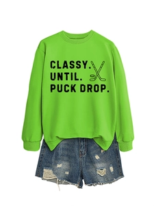 Neon green hockey slogan sweatshirt paired with distressed blue denim shorts set