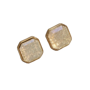 Elegant white geometric square stud earrings with golden finish on a clean white background