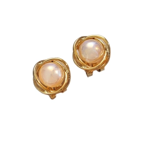 Elegant gold pearl stud earrings with vintage bird nest wire wrapping on white background