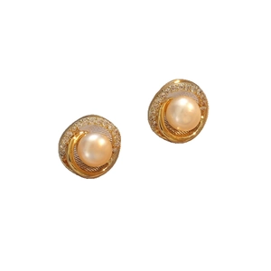 Elegant gold swirl pearl stud earrings with sparkling cubic zirconia accents for women