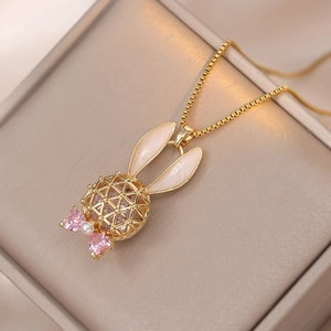 Golden hollow rabbit pendant necklace with pink heart crystals and pearl detail