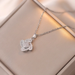 Sparkling silver four-leaf clover zircon pendant necklace with luxury champagne jewelry box
