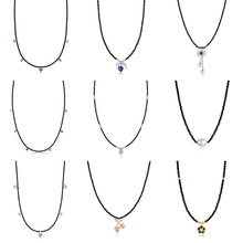Detailed grid of nine elegant necklaces featuring diverse pendants on black cords