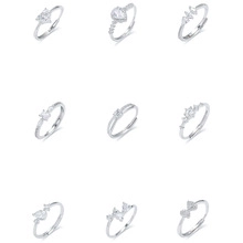 Detail of nine S925 silver rings set with zircon in heart and geometric shapes