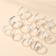 Set of 14 silver bohemian rings featuring minimalist bands and small pearls for women