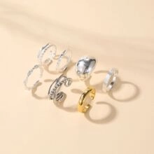 Detail of 6-piece minimalist ring set featuring silver and gold tones with textured bands