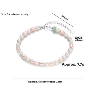 Detailed close-up of S925 silver tag and green jade bead on freshwater pearl bracelet