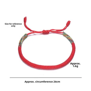 Close-up of handmade red braided cord bracelet with 26cm perimeter and 1.6g weight