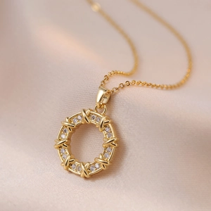 Elegant gold zircon donut necklace featuring a refined X-shaped cross-stitch pattern