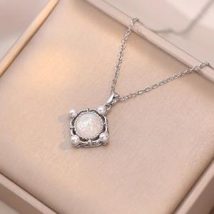 Elegant opal necklace with square silver frame and pearls in a velvet jewelry box