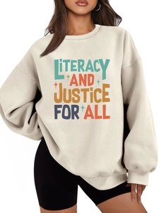 Detail of ribbed neckline and vintage Literacy and Justice for All print on beige sweatshirt
