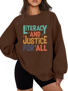 Detail of soft brown cotton sweatshirt with colorful literacy and justice text print