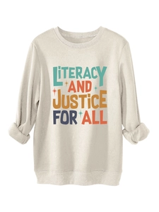 Detail of light beige cozy sweatshirt featuring Literacy and Justice for All text print