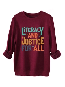 Detail of the Literacy and Justice for All print on a thick burgundy sweatshirt