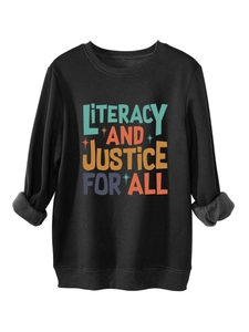 Detail of colorful LITERACY AND JUSTICE FOR ALL print on a cozy black cotton sweatshirt