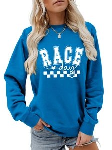 Close-up of blue sweatshirt with white RACE day text and checkered flag graphic detail