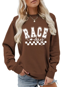Close-up of brown Race Day sweatshirt with ribbed cuffs and checkered flag print